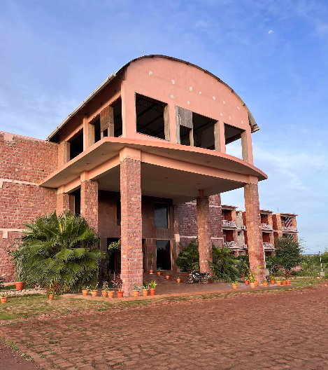 Swimming pool with palm trees at Kanthi Resorts Bagalkot